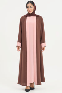a brown and pink abaya on a white background