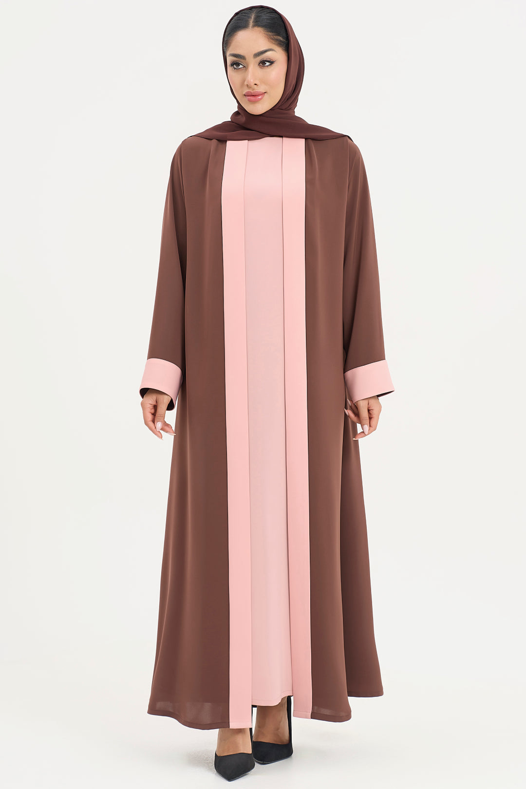 a brown and pink abaya on a white background
