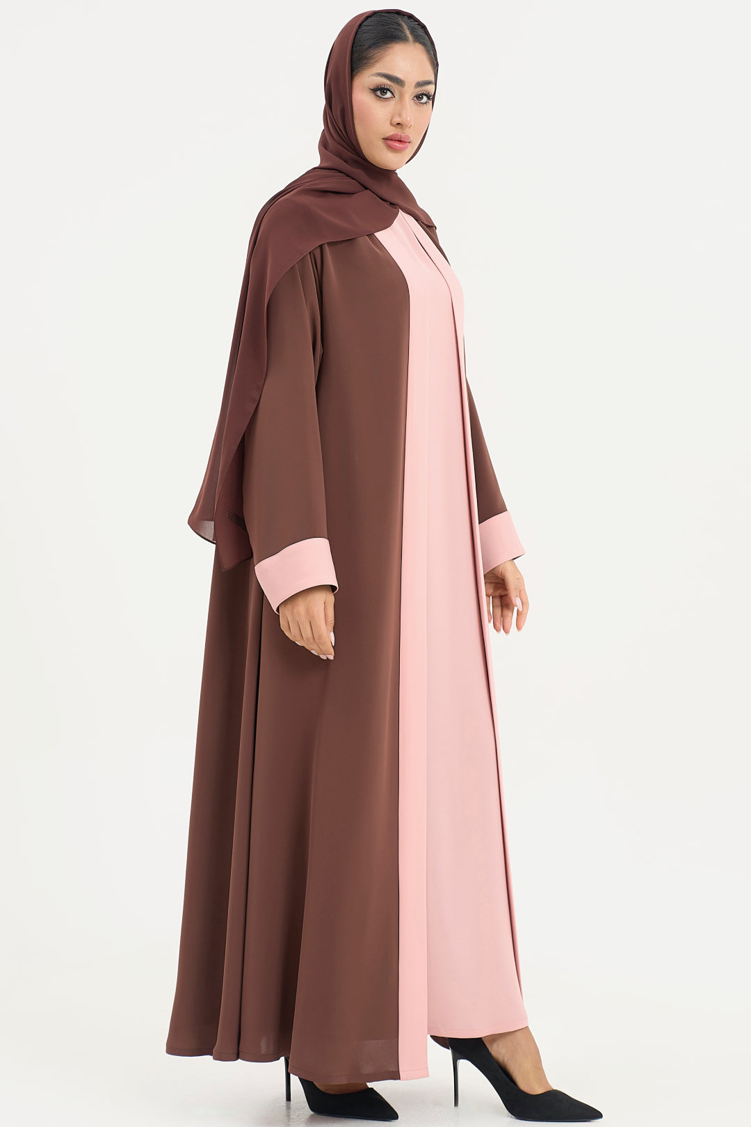 a brown and pink abaya on a white background