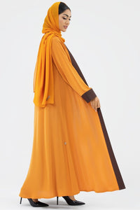 Woman wearing a Two-toned Orange Colored Abaya