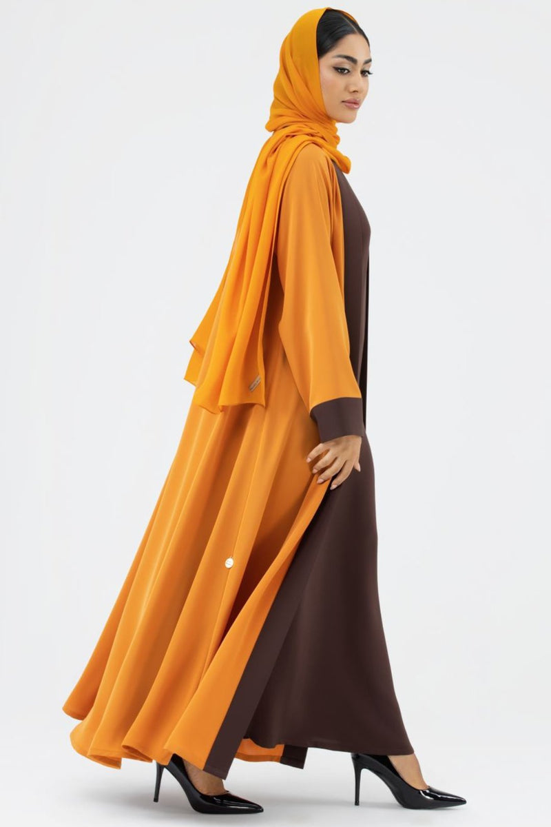 Woman wearing a Two-toned Orange Colored Abaya