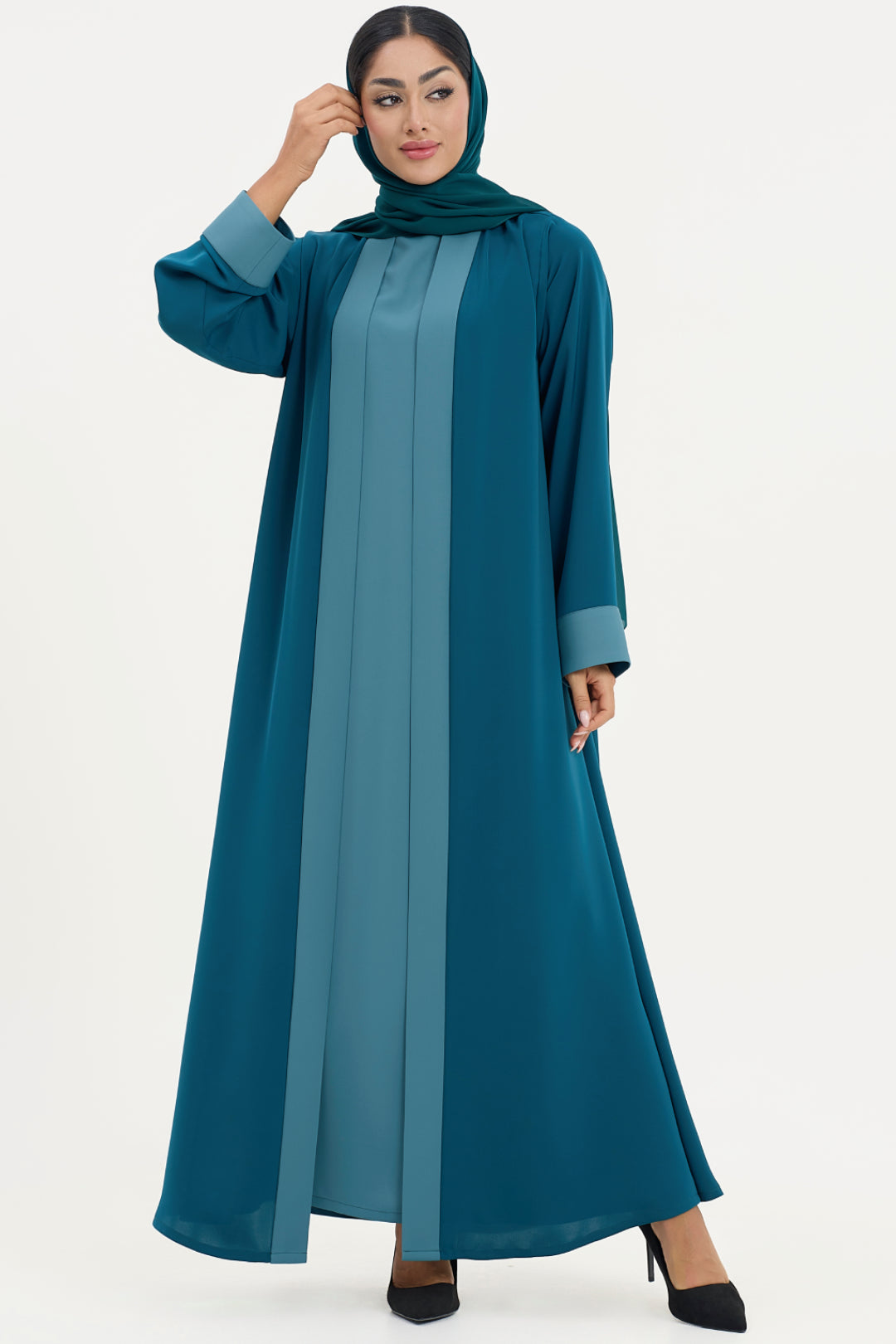 teal abaya, blue dress with a white background