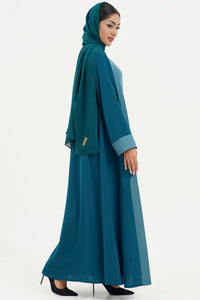 a teal abaya with matching hijab on a white background