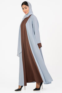 Long light blue Abaya over a brown dress