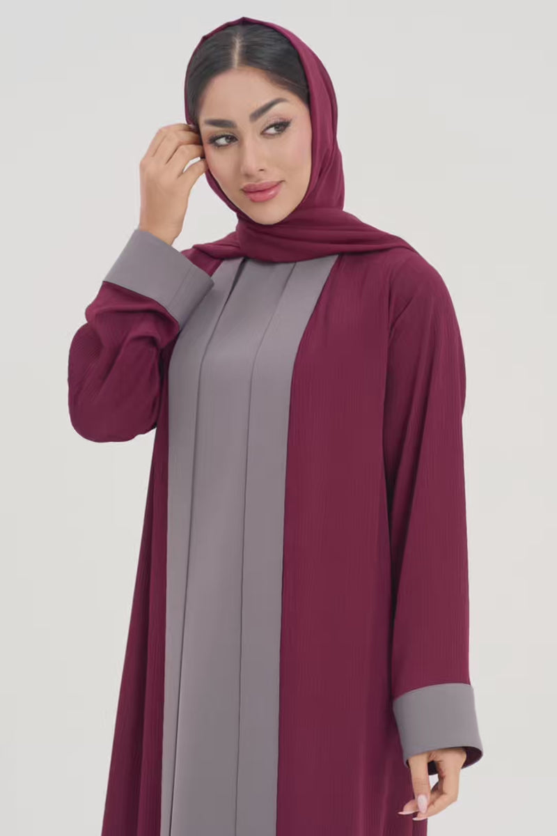 Woman in Noor Abaya, two-toned burgundy and grey elegant abaya video