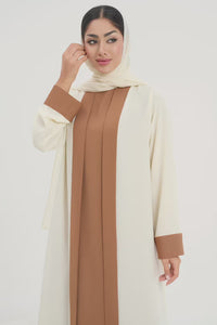 Rana Abaya in a two-toned off-white and camel color abaya video