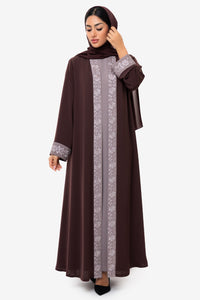 Straight view of a woman wearing the Honia Abaya in elegant brown