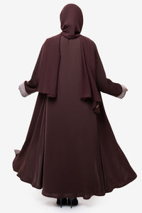 Woman wearing the Honia Abaya in elegant brown back view