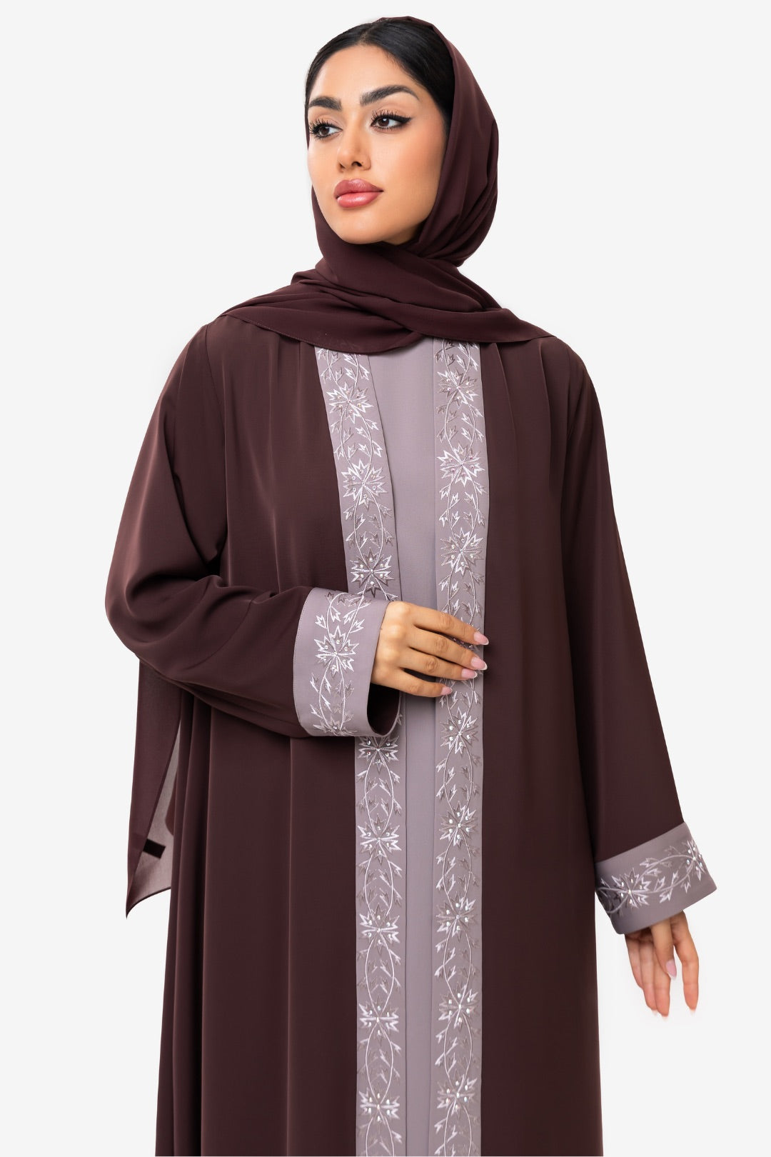 front view of a woman wearing the Honia Abaya in elegant brown