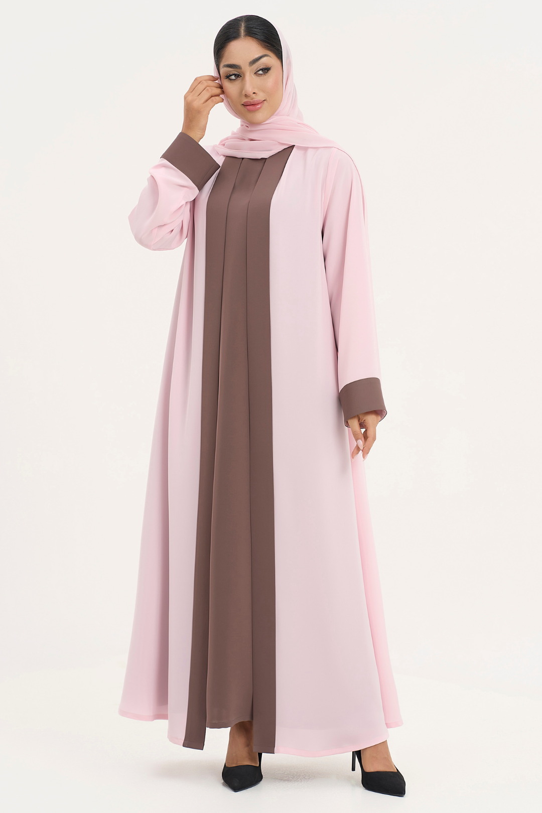 Stylish Mayowa abaya in soft pink and brown worn by woman, standing straight pose